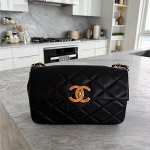 CHANEL Black Quilted Shoulder Bag with Gold CC Lock